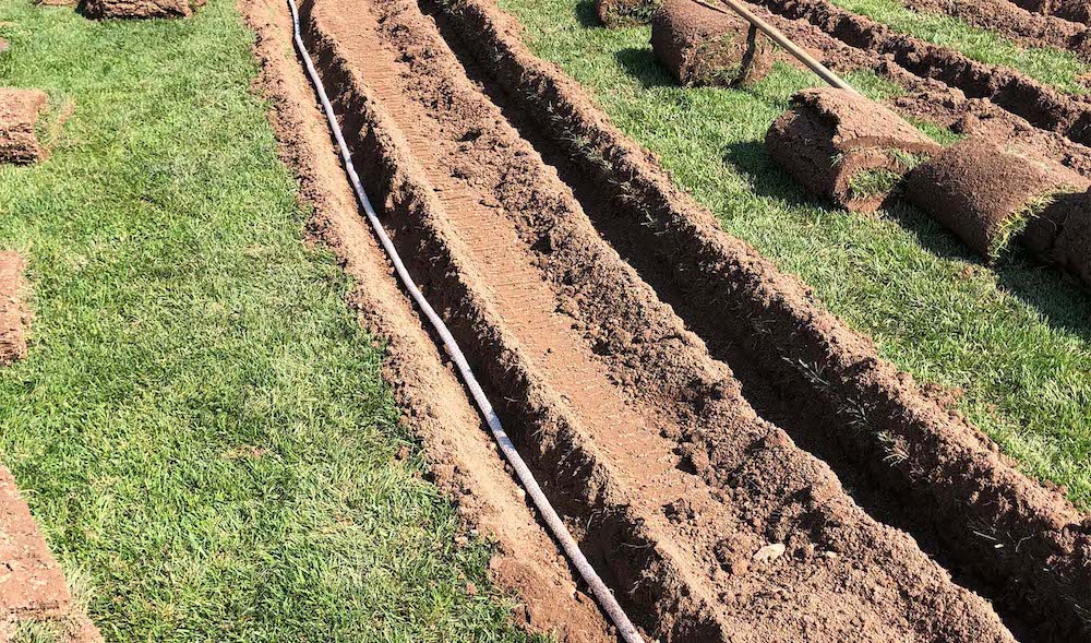 Trenches Being Dug for Drainage Installation