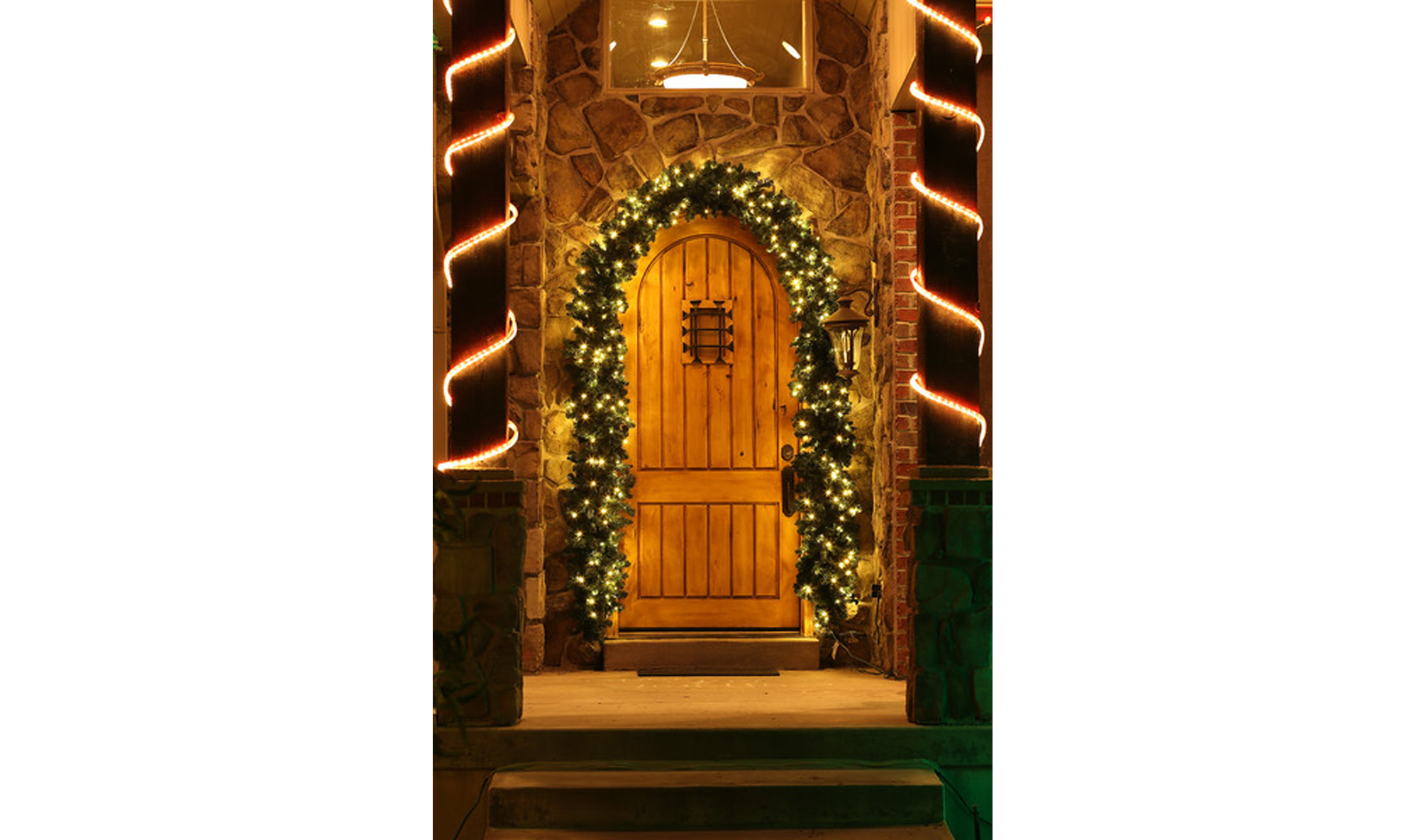 Front door With Garland and Holiday Lights